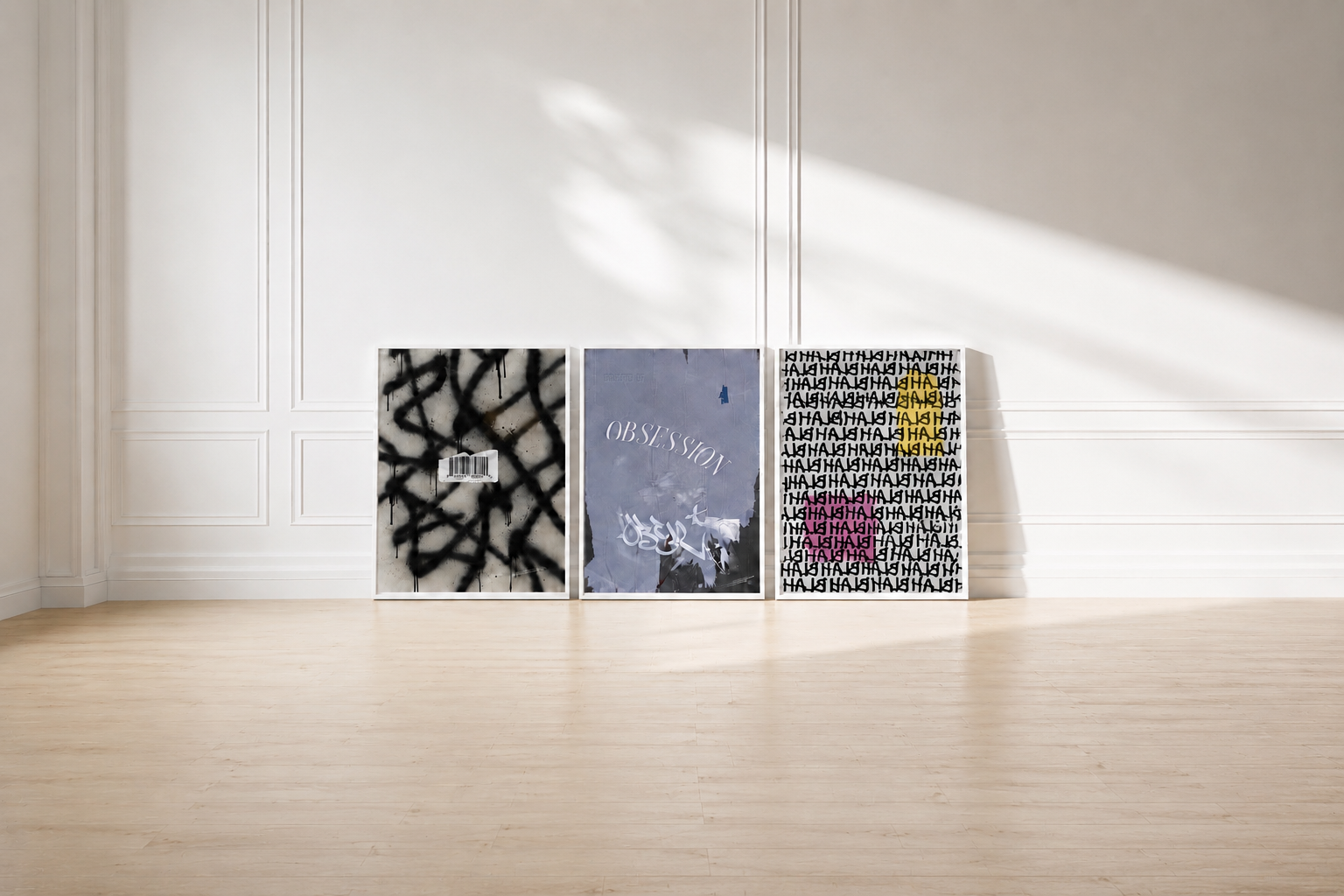Modern wall art displayed in white box frames against a bright paneled wall, featuring three contemporary artwork prints in a minimalist gallery-style interior with natural sunlight and light wood flooring.