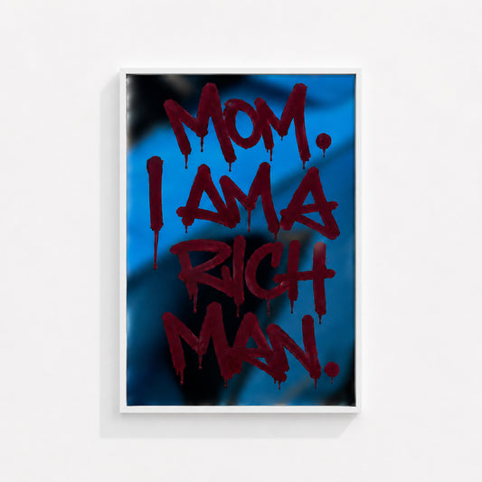 MOM. I AM A RICH MAN wall art print in a white box frame featuring bold red typography on a vibrant blue background